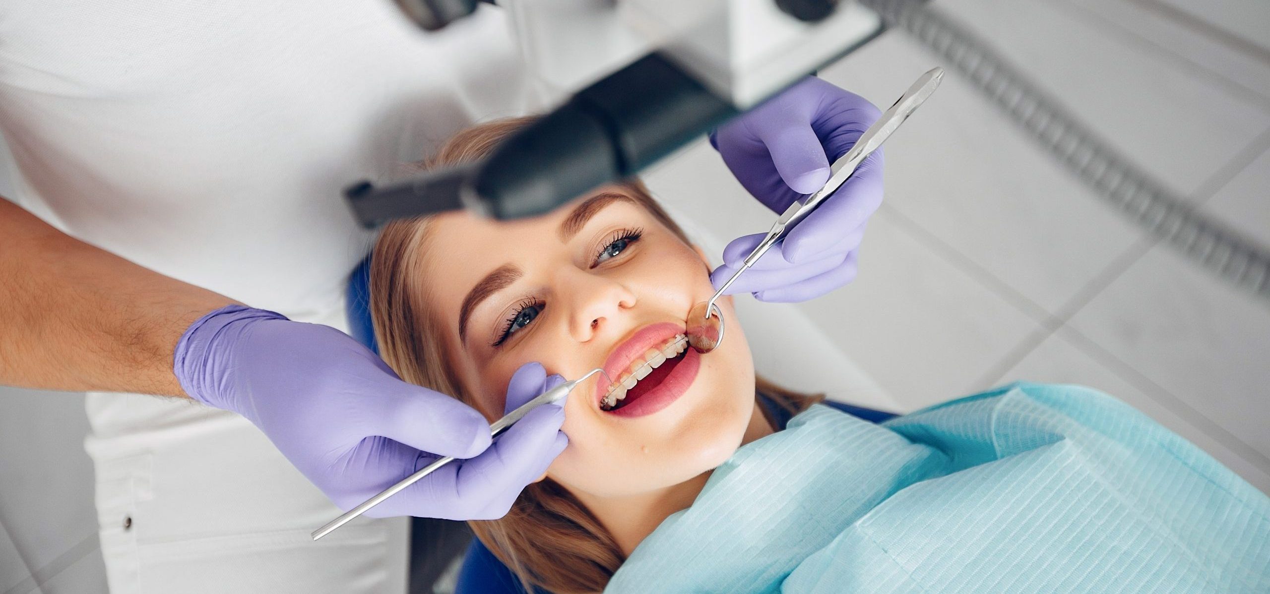 Beautiful lady in the dentist's office. Woman in a uniform